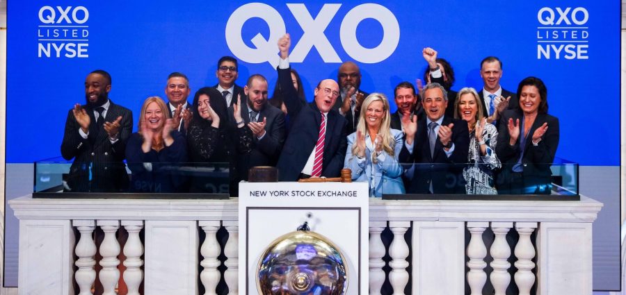 QXO executives, led by Brad Jacobs (center), ring the New York Stock Exchange opening bell on April 30, 2025, which also marked the closing of the company's acquisition of Beacon. (NYSE photo)