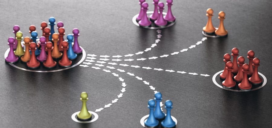 3D illustration of many pawns segmented in different categories over black background. concept of customer segmentation.