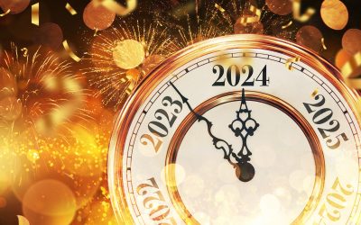 Vintage gold clock New Year 2024 with confetti, golden bokeh lig