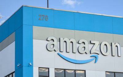 Amazon company logo with damaged letter 'n' on warehouse office building in Red Hook, Brooklyn, New York City.