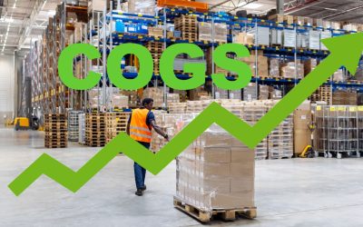 Rear view of a dock worker walking with packages on pallet jack at distribution warehouse. Young male dispatcher pulling pallet jack with boxes.