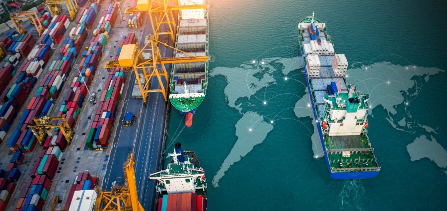 Aerial top view containers ship cargo business commercial trade logistic and transportation of international import export by container freight cargo ship with on worldmap