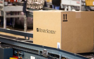 health care distributor Henry Schein box on conveyor belt