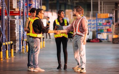 A group of warehouse employees, Inspecting products on warehouse shelves before they are sent to retailer
