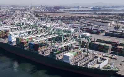 Aerial views of a cargo ship being unloaded at the Port of Los Angeles.
