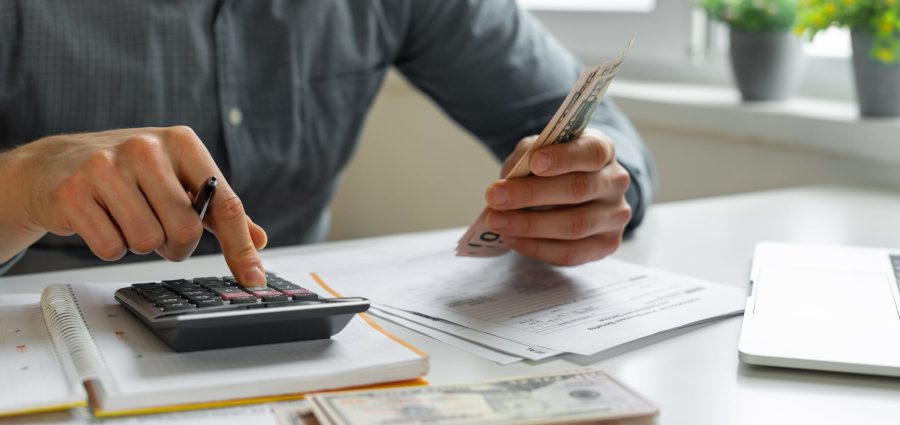 Man using calculator