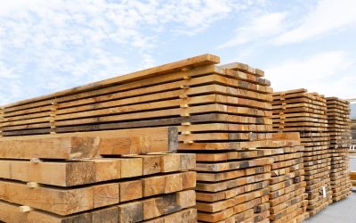 Stack of lumber and planks in a lumber warehouse outdoors