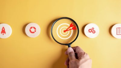 Magnifying glass focus to target icon which for planning development leadership and customer target group to success business corporate concept.