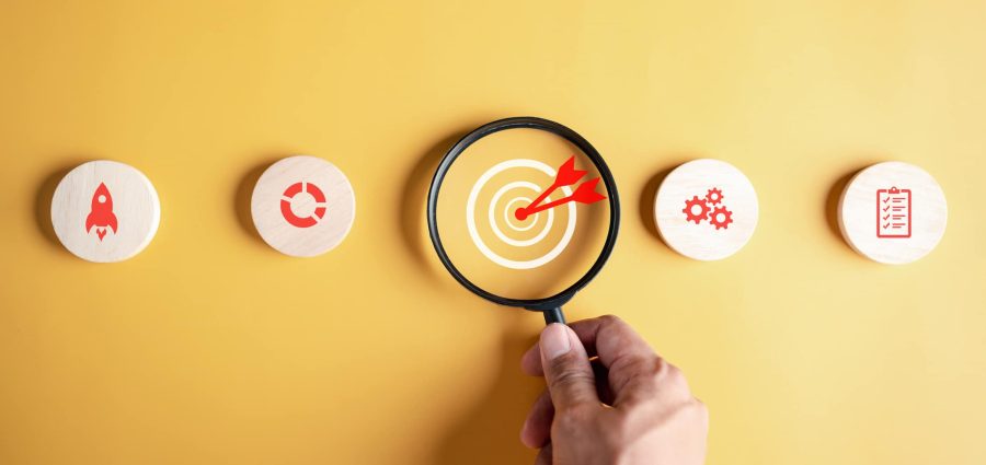 Magnifying glass focus to target icon which for planning development leadership and customer target group to success business corporate concept.