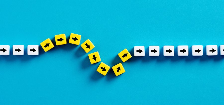 Flexibility and adaptation concept. Arrows on cubes following a flexible path.