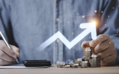 Businessman hand drawing virtual increasing graph with money coins stacking , Business investment profit and deposit dividend saving growth concept.