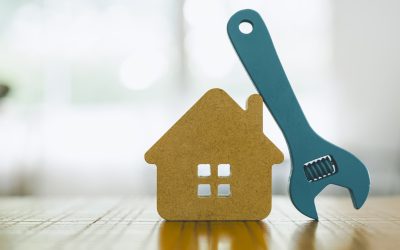 Model house and wrench, home services. Home repairs concept.