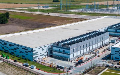 Aerial view of a large data center campus with focus on the processor hosting area and power and cooling infrastructure being built in Hutto TX