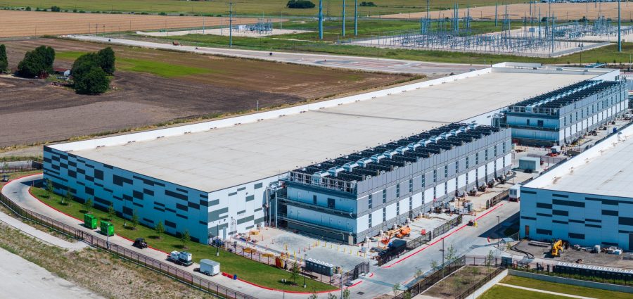 Aerial view of a large data center campus with focus on the processor hosting area and power and cooling infrastructure being built in Hutto TX