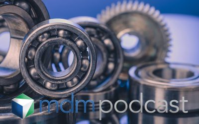 Group of various ball bearings and gears close up on nice blue background with reflections.