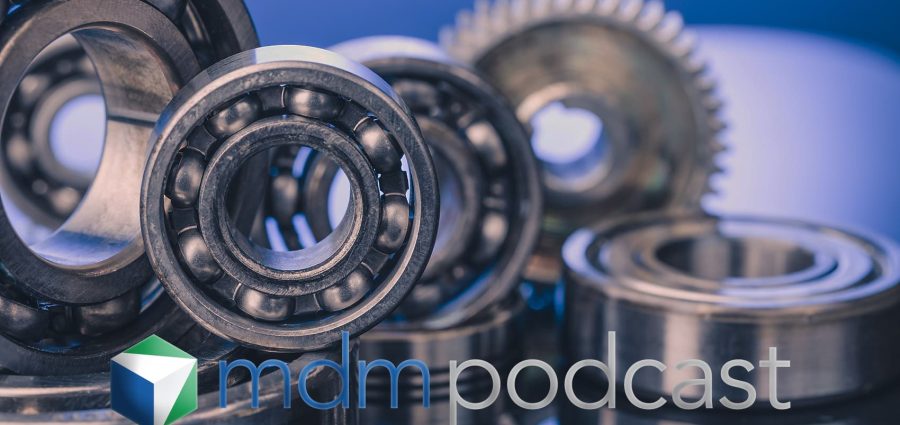 Group of various ball bearings and gears close up on nice blue background with reflections.