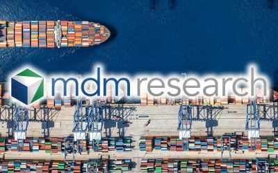 Aerial top down view of a large container cargo ship terminal harbor with loading activity and vessel traffic